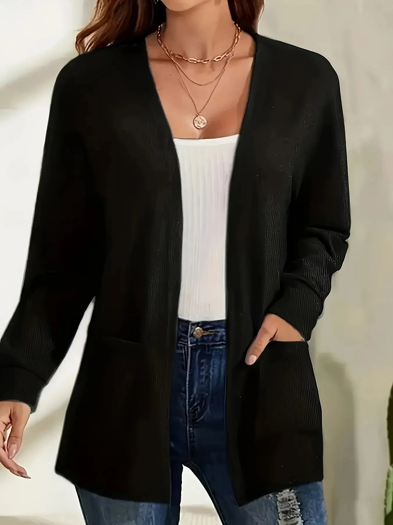 Autumn and winter European and American foreign trade thin fashion solid color pocket thin knitted women's buttonless cardigan